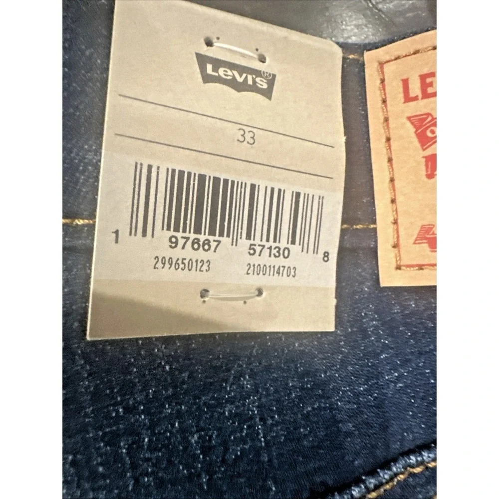 Levi's Women Size 33 Mid Length Blue Denim Shorts Cuffed Dark Distressed Stretch